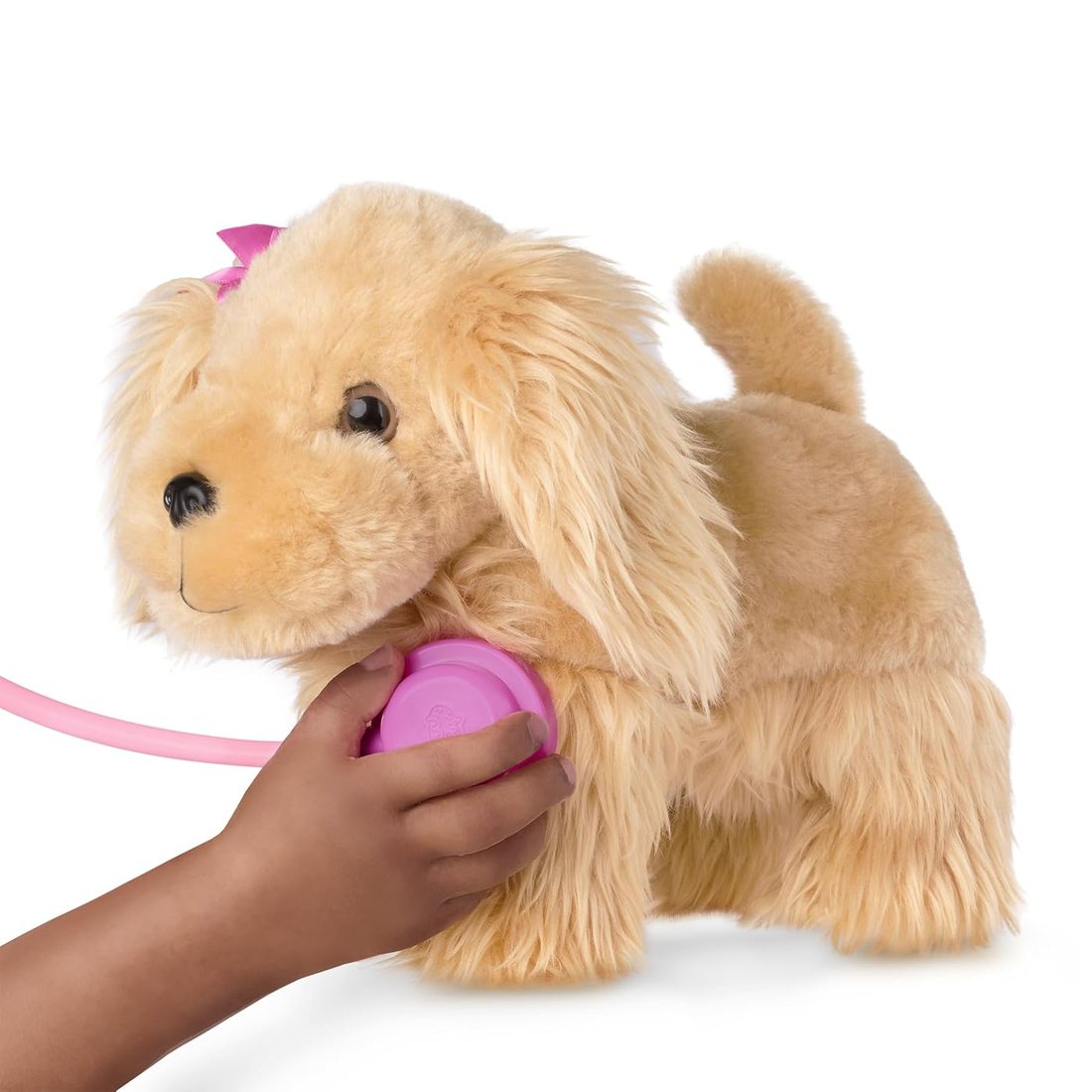 A child brushing a plush Cocker Spaniel from a Pucci Pups vet care set