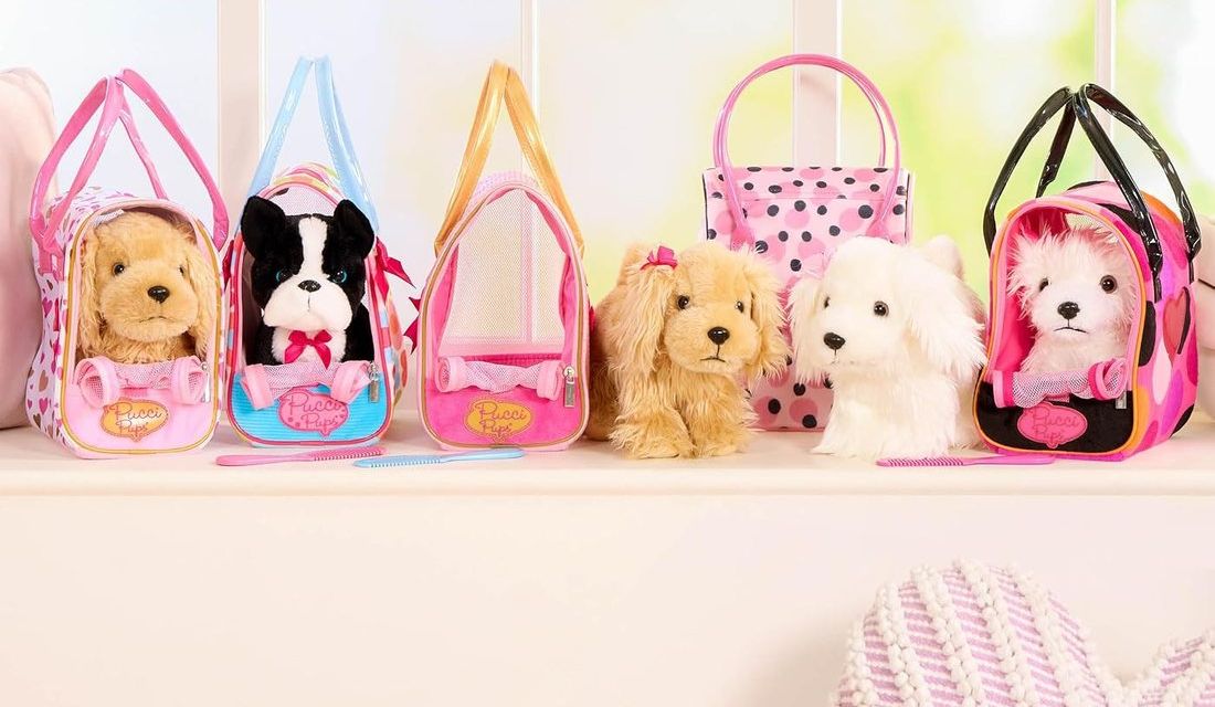 Pucci Pups plush puppies waiting in their carrier bags on a sunny windowsill
